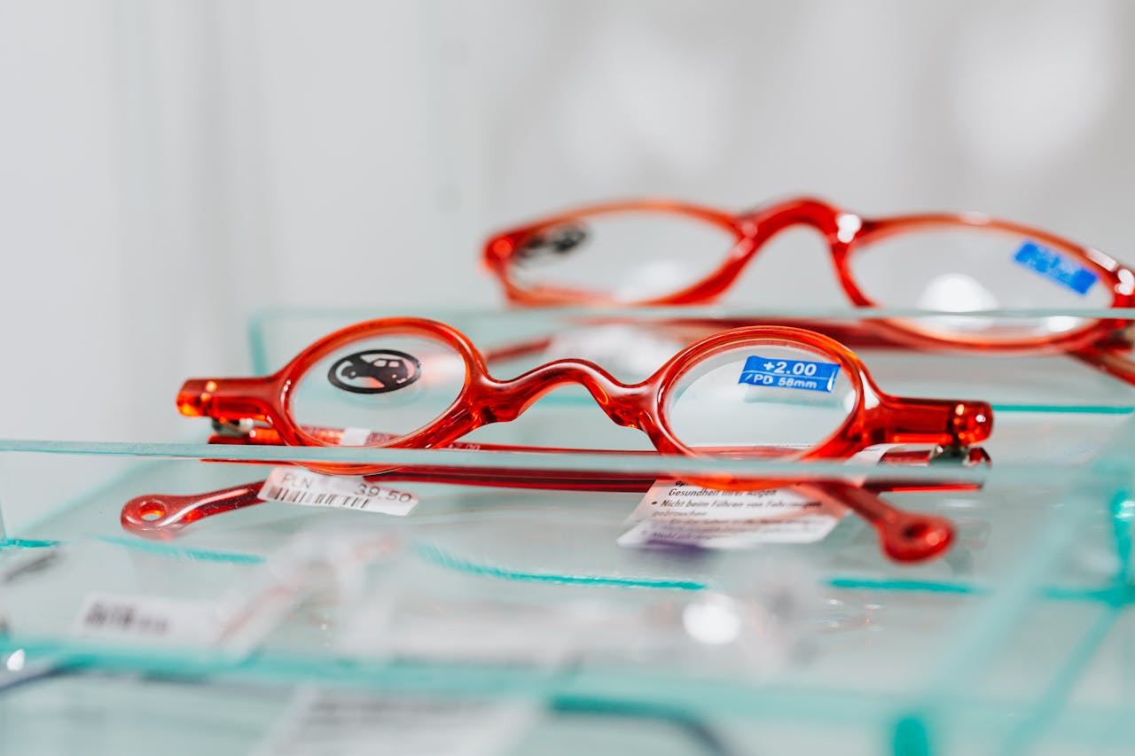 Bright red eyeglasses on display showcasing modern design and optics.